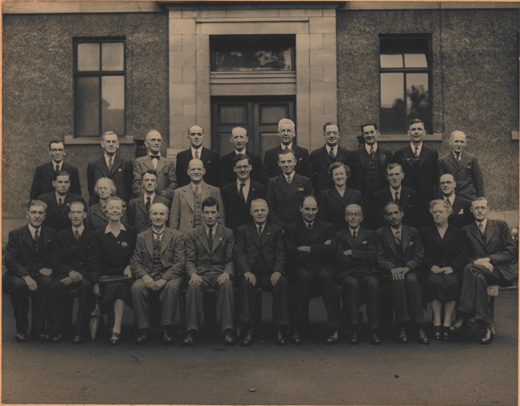 Black and white photograph of the Dundee Trades and Labour Council. Dr Saggar sits in the front row, third from the right.